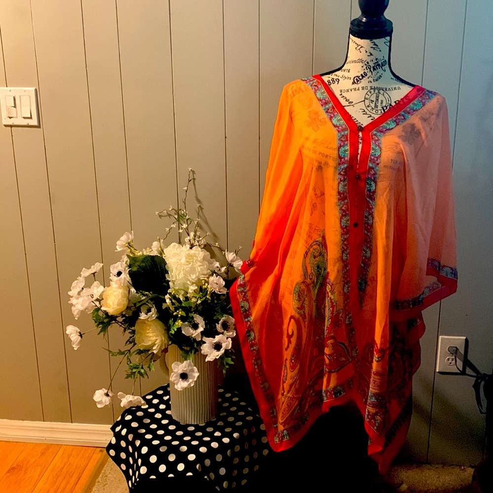 An India-made blouse. Buttons down front and back.